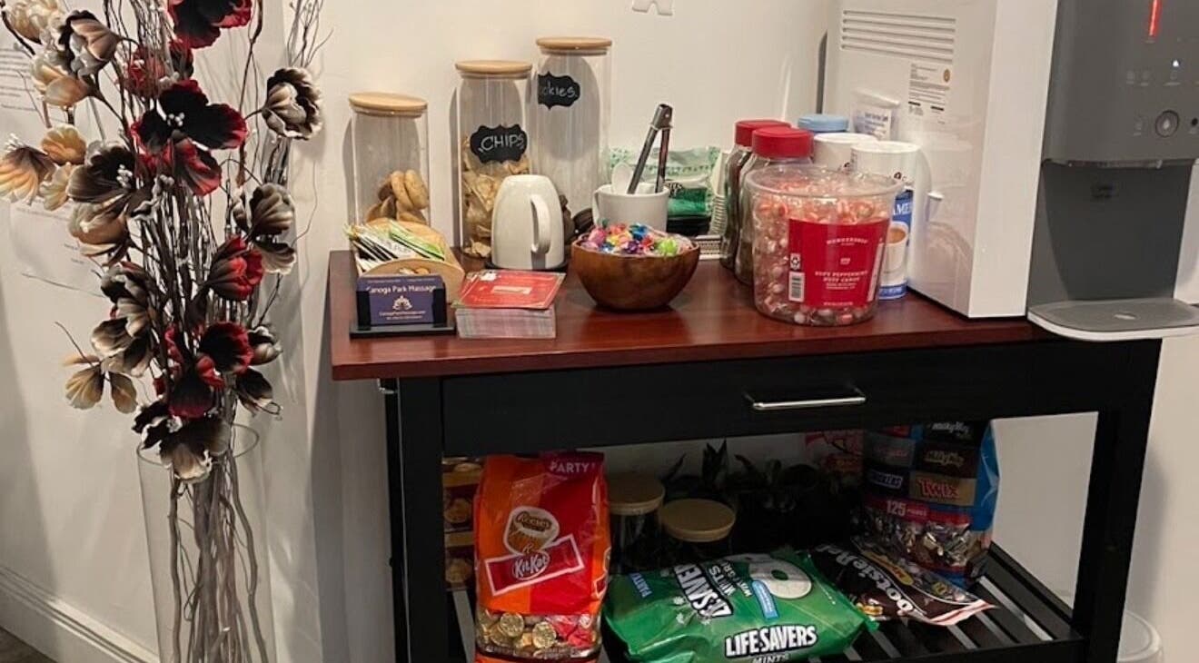 Snack station at Canoga Park Massage, Los Angeles, California, US offering a variety of refreshments.