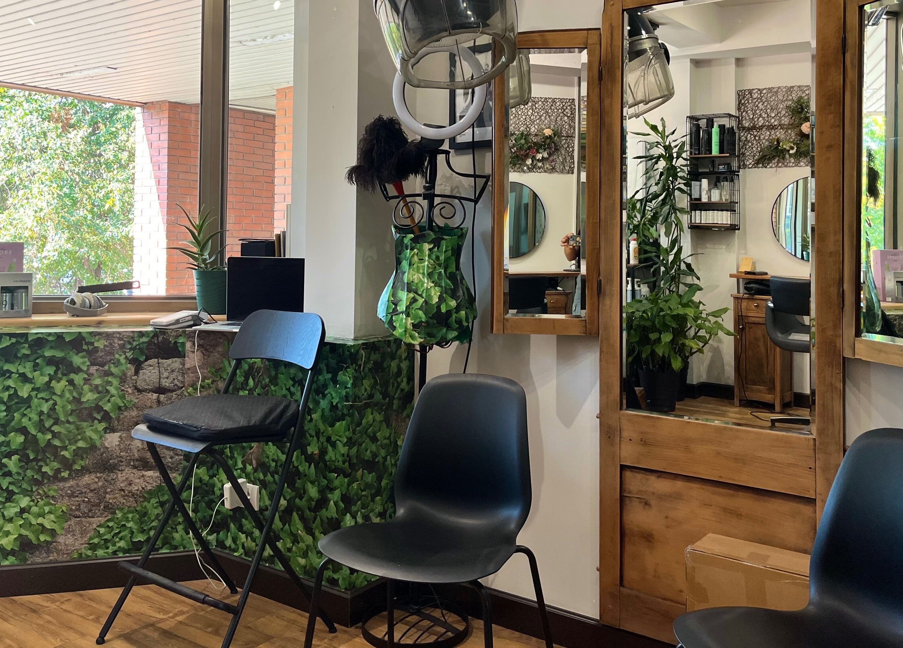 Chic seating at Hjera Studio & Spa, Beograd, RS, with lush greenery and modern decor.