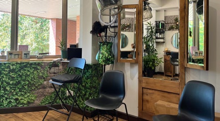 Chic seating at Hjera Studio & Spa, Beograd, RS, with lush greenery and modern decor.