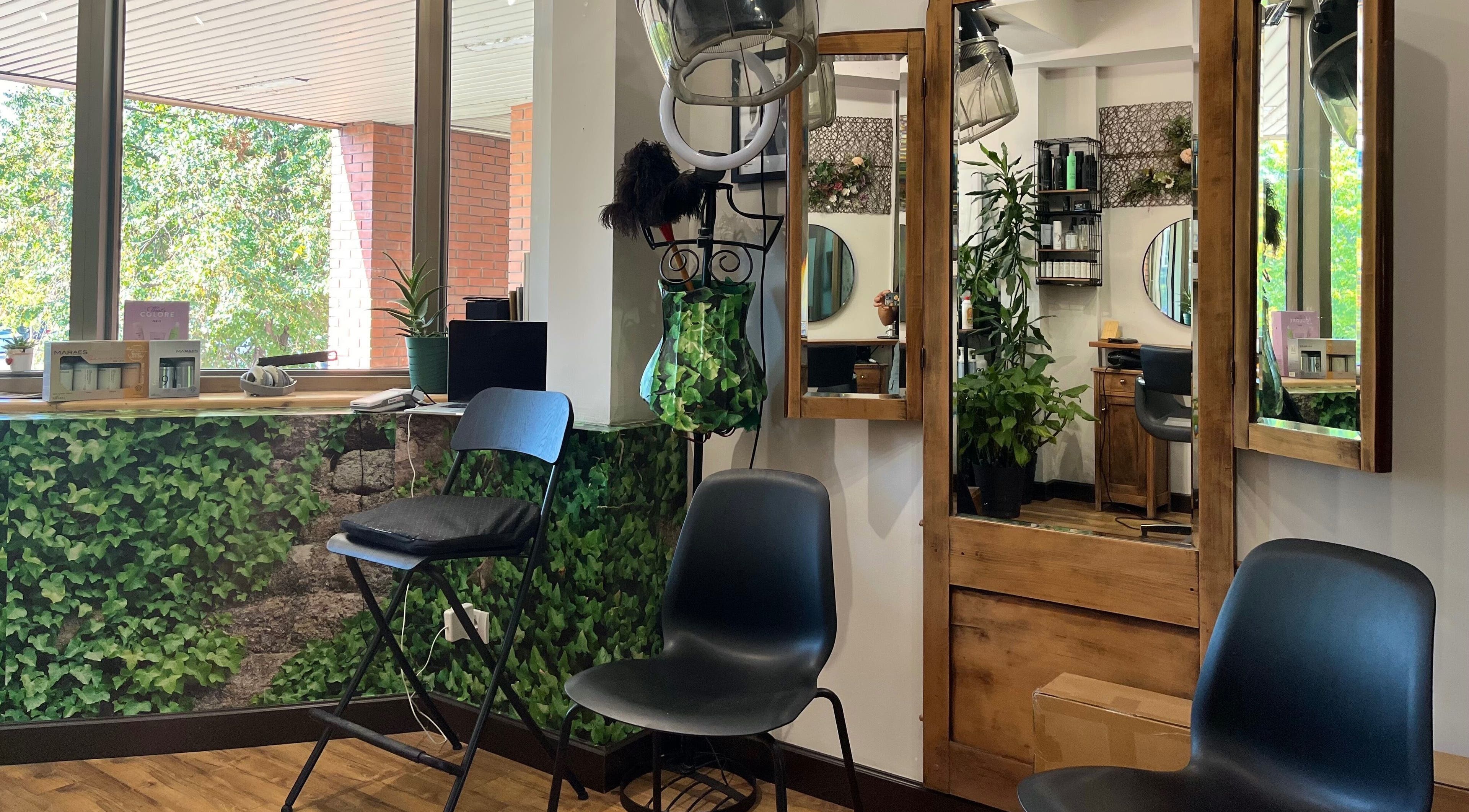 Chic seating at Hjera Studio & Spa, Beograd, RS, with lush greenery and modern decor.