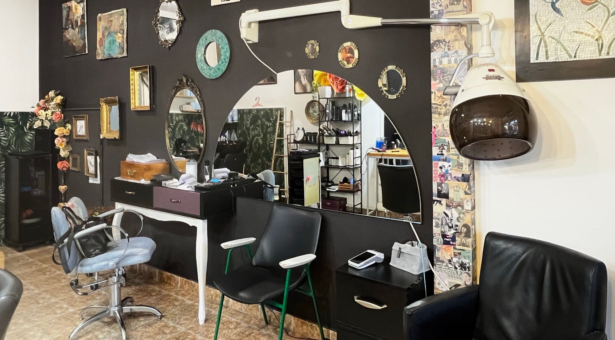 Chic salon interior at Hjera Atelje, Beograd, RS, featuring elegant decor and professional styling equipment.