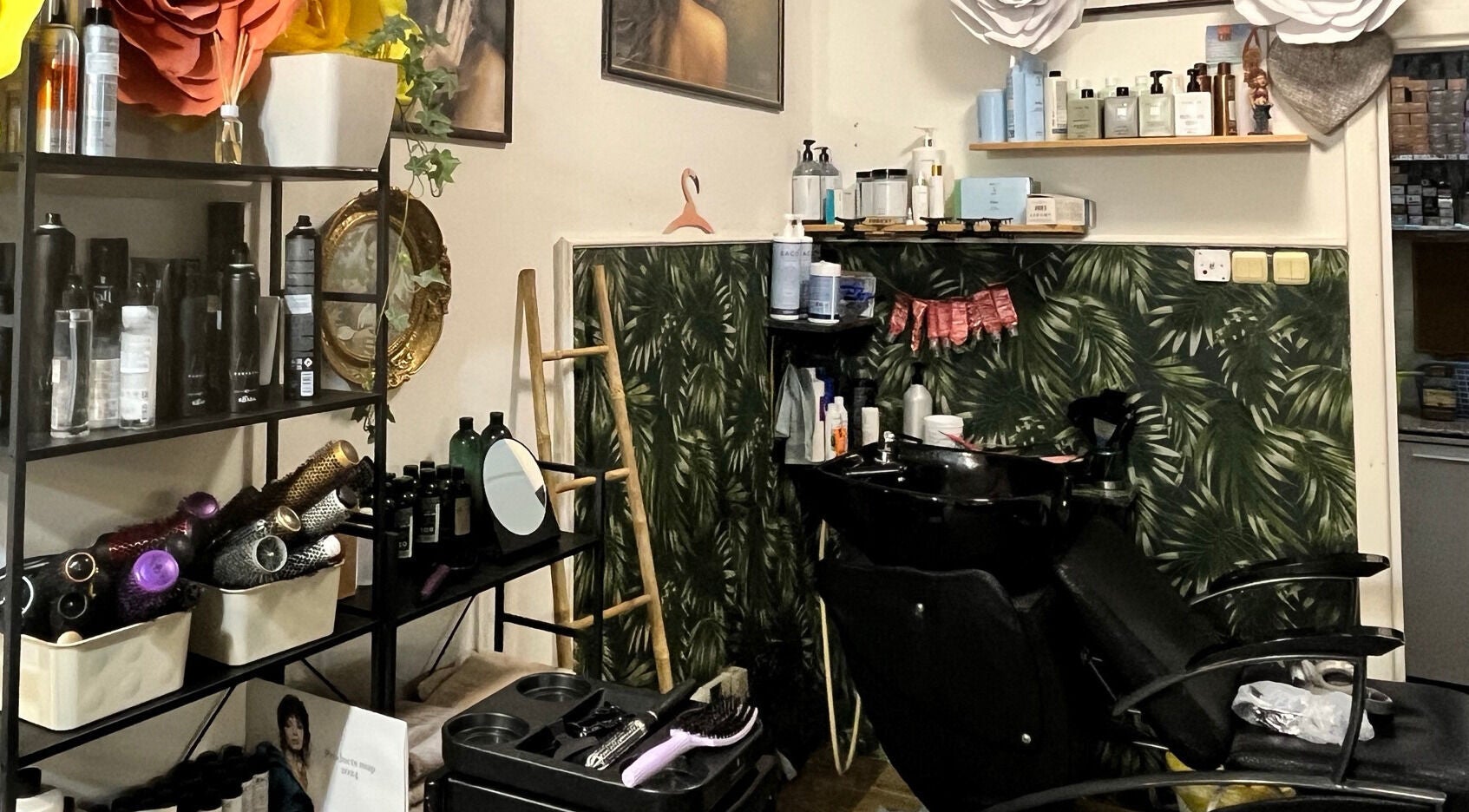 Hjera Atelje salon interior in Beograd, RS, featuring styling area with elegant decor and hair products.