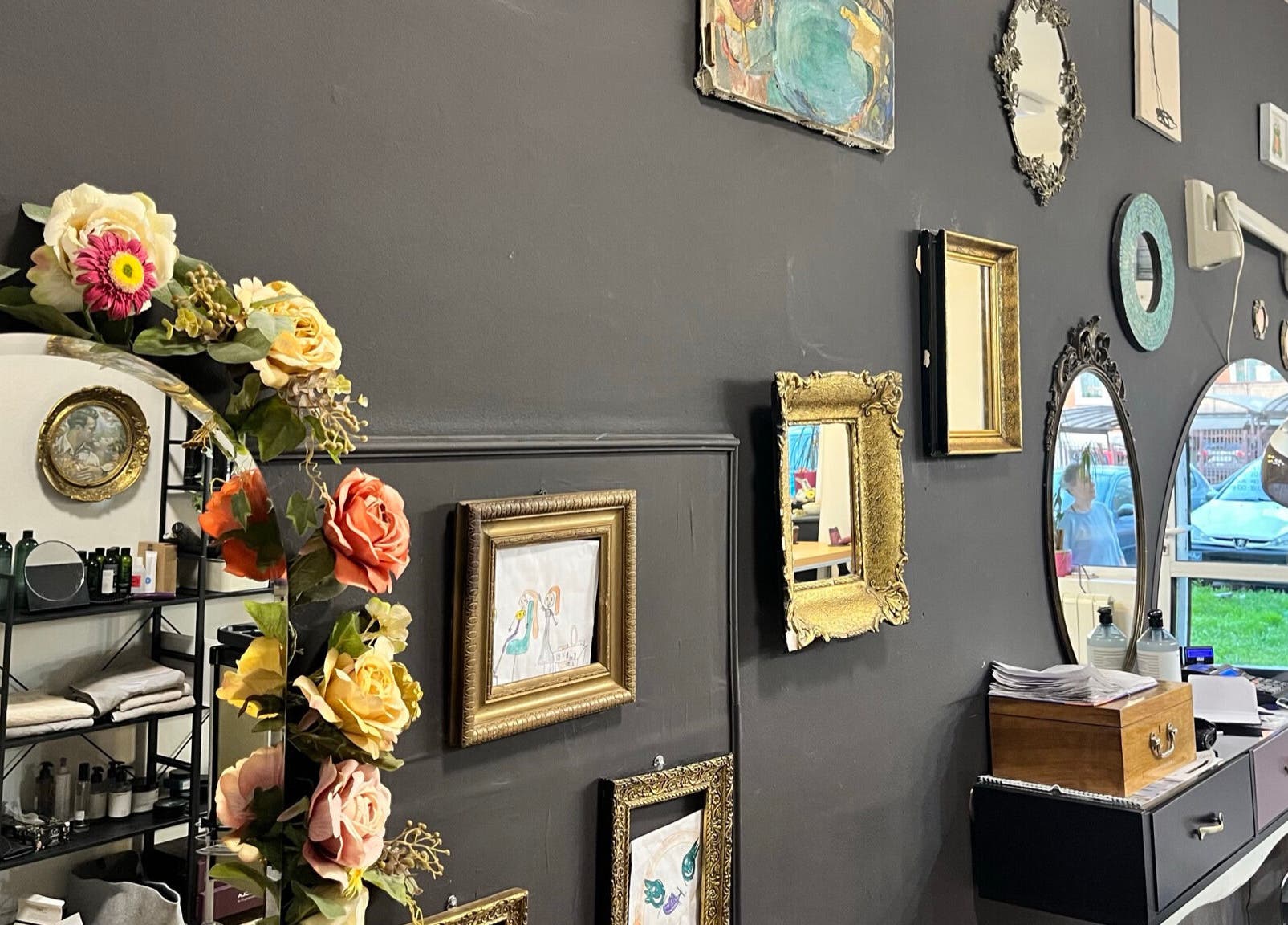 Vintage mirrors and floral decor in Hjera Atelje, Beograd, RS, creating a cozy aesthetic.