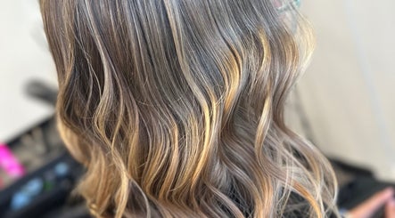 Stylish wavy hair highlighting expert styling at EMWHAIR, Newport Pagnell, England, GB.