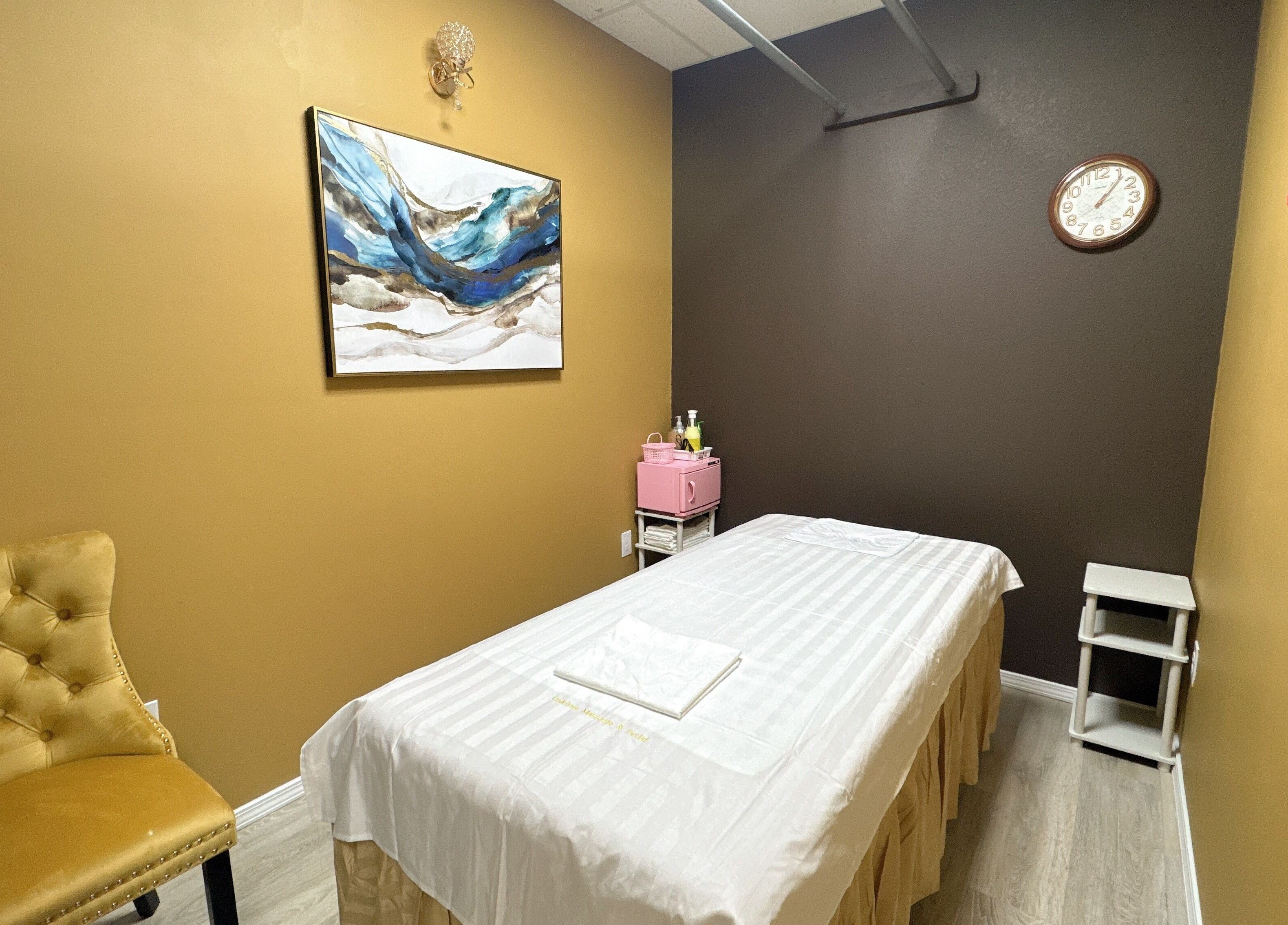 Cozy massage room at Oak Tree Massage & Facial Lovers ln in Dallas, Texas, US with elegant decor.