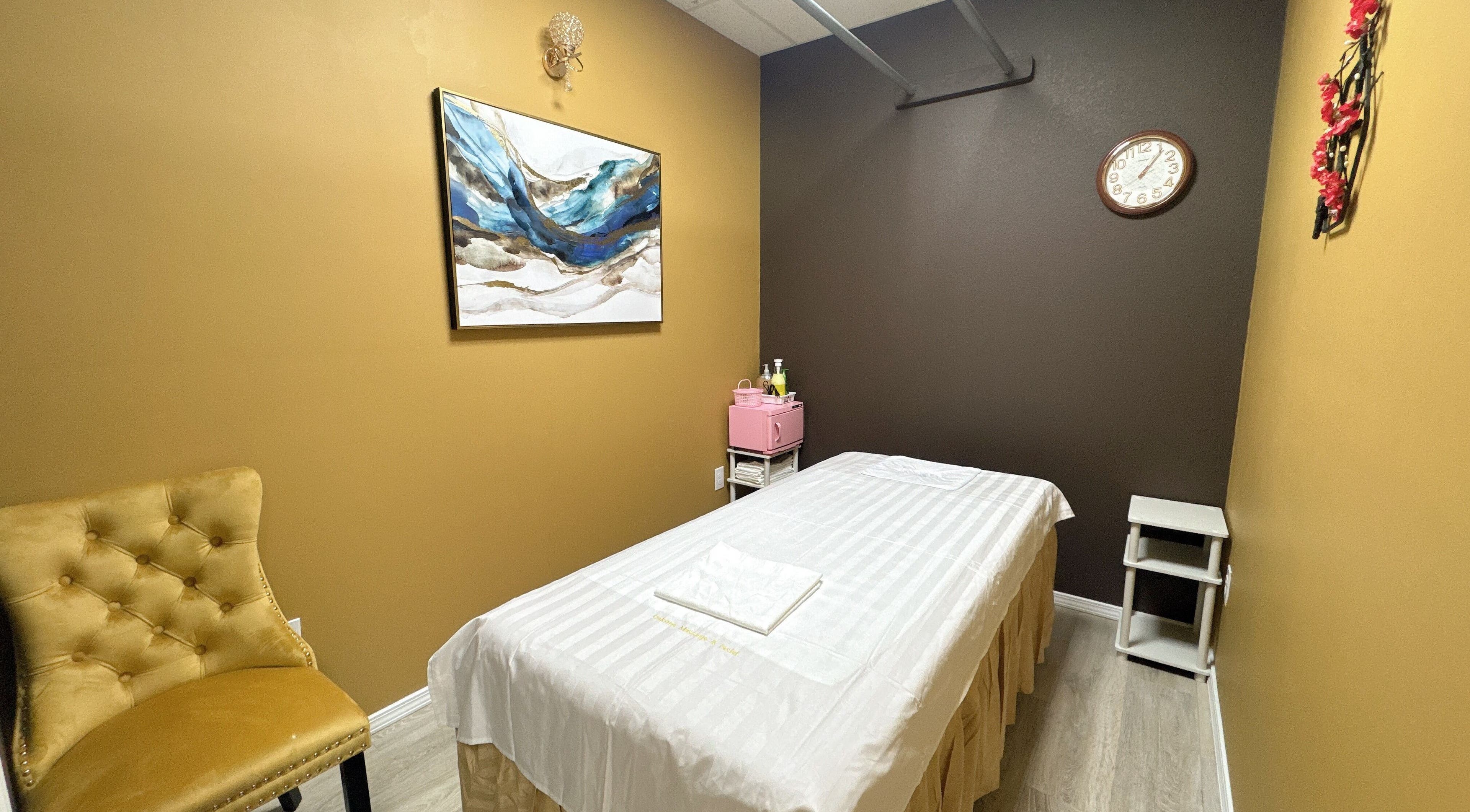Cozy massage room at Oak Tree Massage & Facial Lovers ln in Dallas, Texas, US with elegant decor.