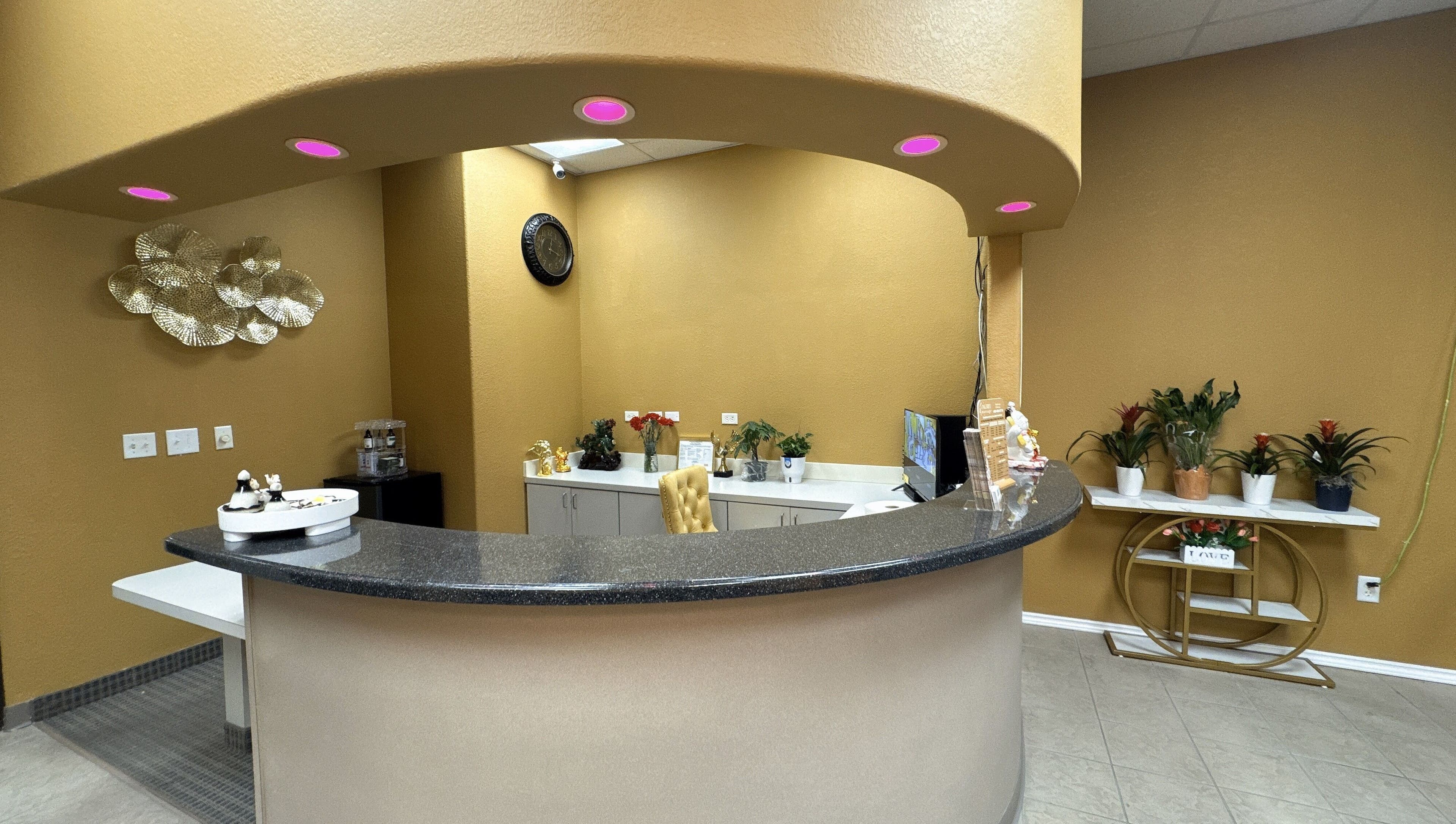 Reception area at Oak Tree Massage and Facial Frisco, showcasing a welcoming desk and decor in Frisco, Texas, US.
