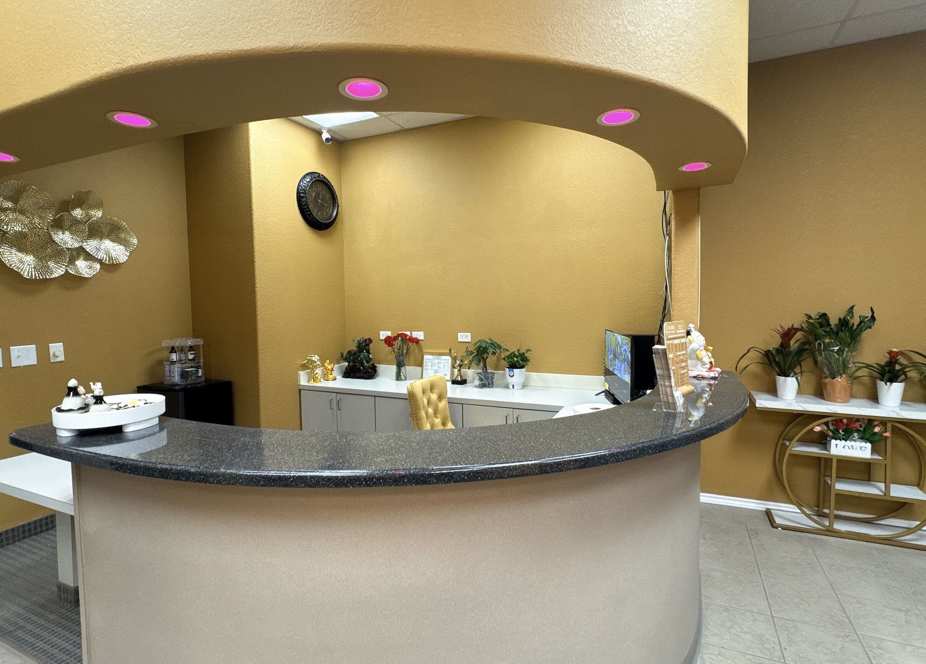 Reception area at Oak Tree Massage and Facial Frisco, showcasing a welcoming desk and decor in Frisco, Texas, US.