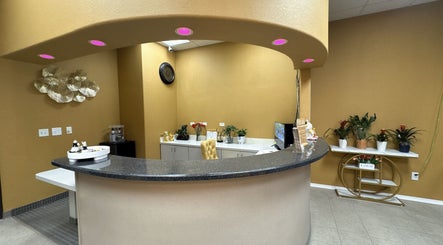 Reception area at Oak Tree Massage and Facial Frisco, showcasing a welcoming desk and decor in Frisco, Texas, US.