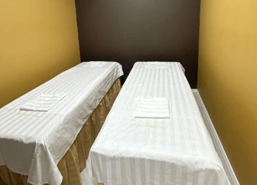 Twin massage beds at Oak Tree Massage & Facial Lovers ln, Dallas, Texas, US, offering relaxation and comfort.