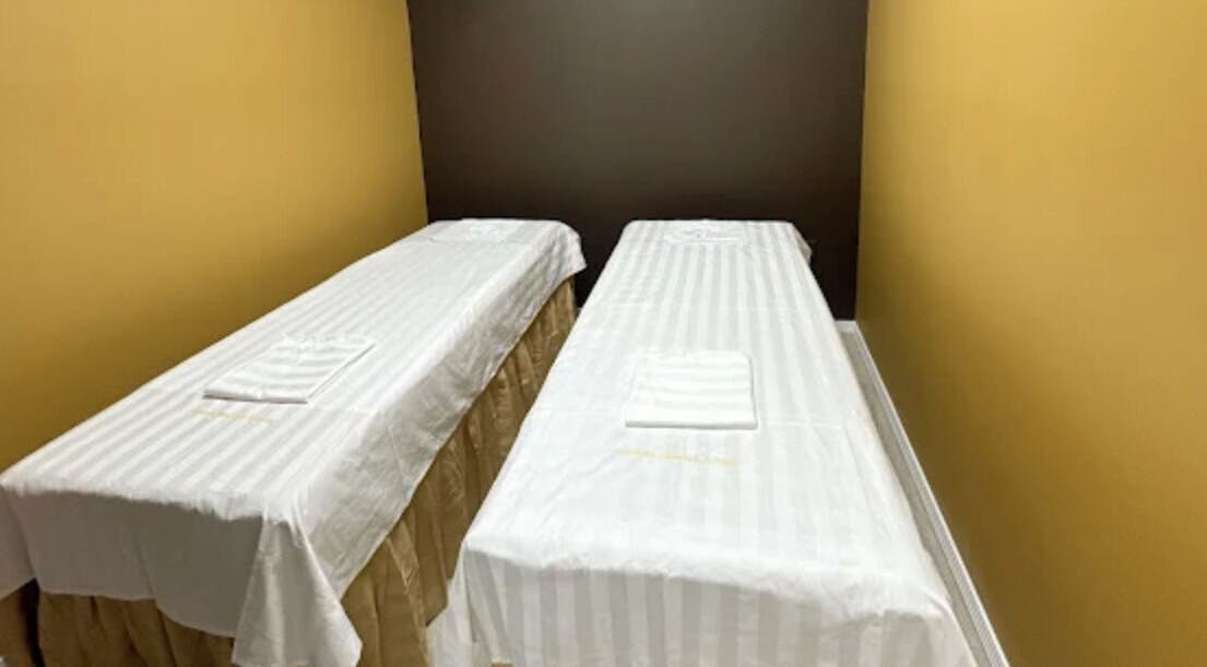 Twin massage beds at Oak Tree Massage & Facial Lovers ln, Dallas, Texas, US, offering relaxation and comfort.