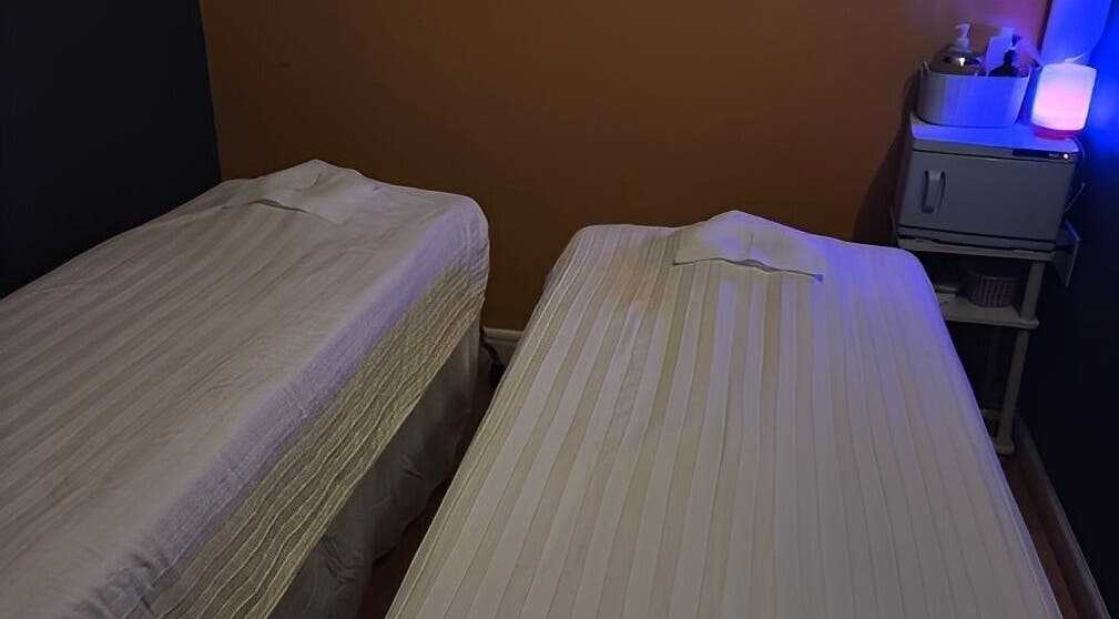 Relaxing massage room at Oak Tree Massage Oak Lawn, Dallas, Texas, US, featuring two comfortable massage tables.