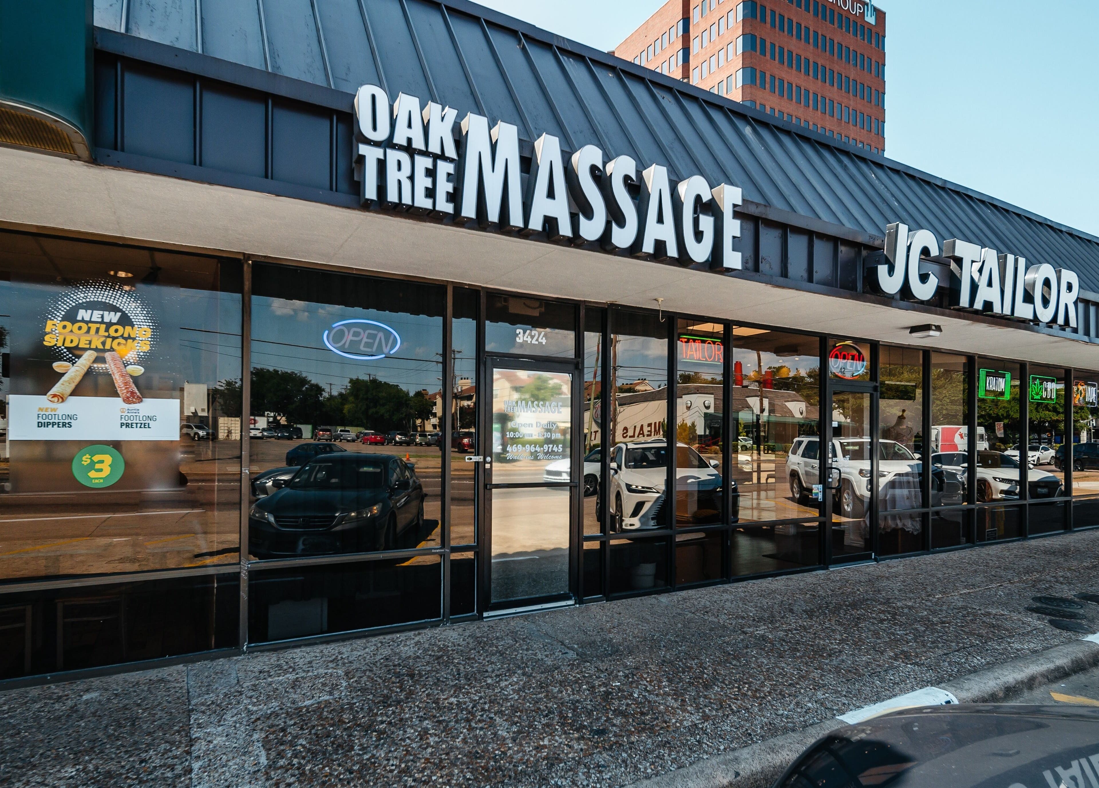 Front view of Oak Tree Massage Oak Lawn in Dallas, Texas, US, featuring clear signage and modern exterior.
