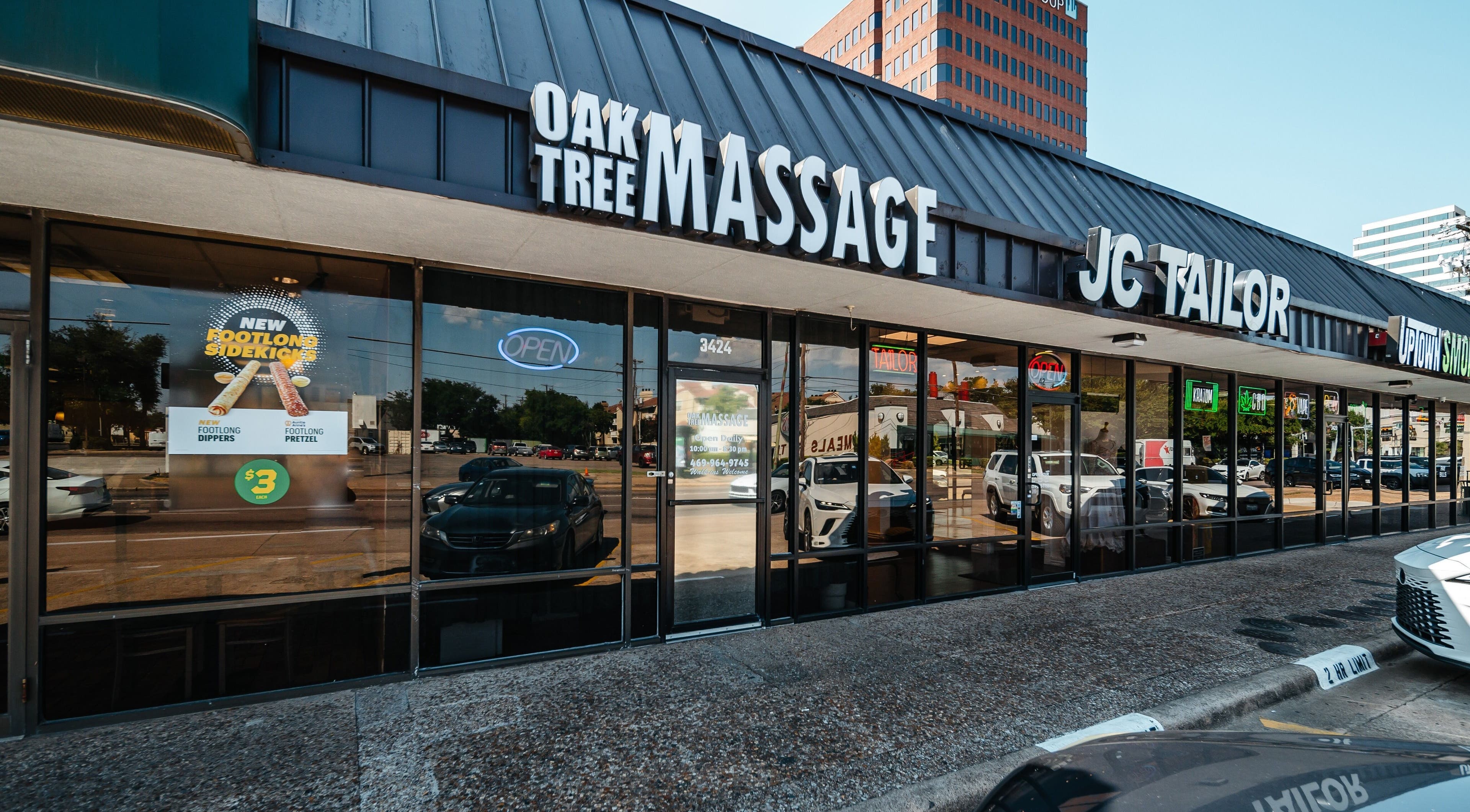 Front view of Oak Tree Massage Oak Lawn in Dallas, Texas, US, featuring clear signage and modern exterior.