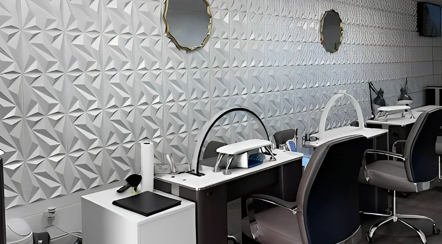 Modern nail salon interior at MY NAILS in Victoria, Texas, US with sleek workstations and mirror decor.