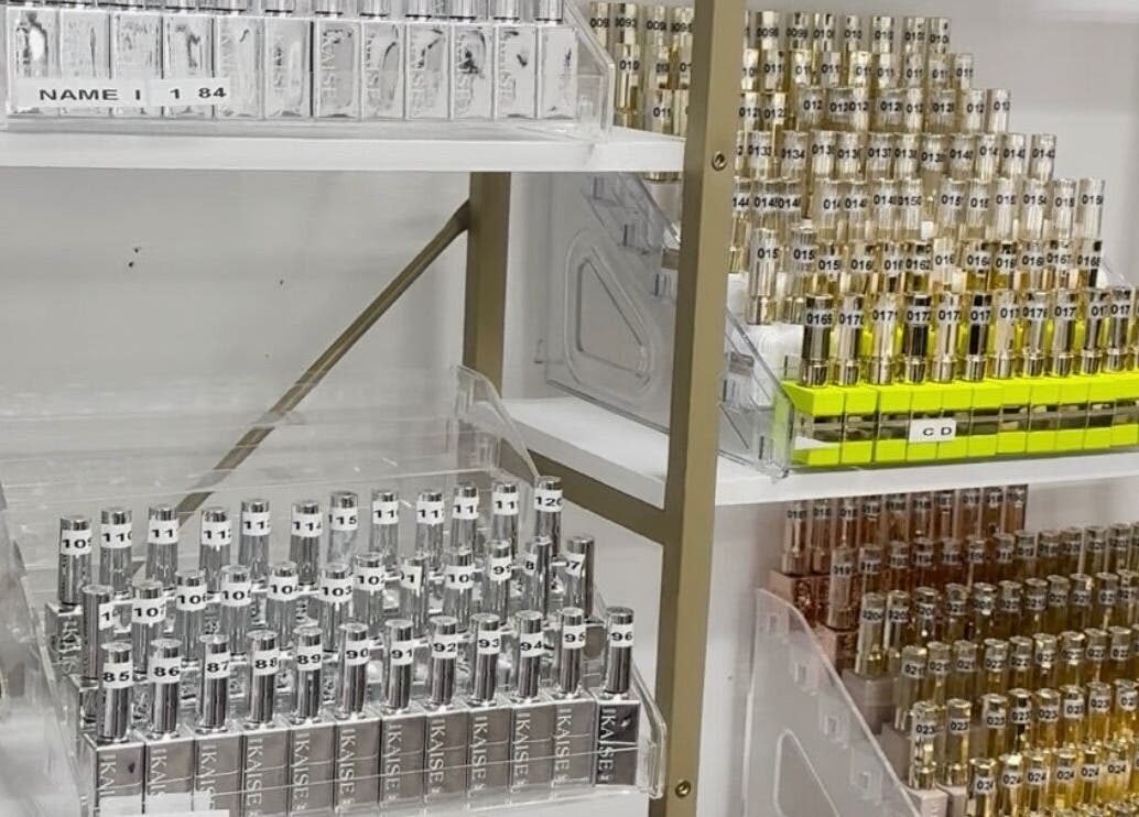Perfume bottles neatly arranged on shelves at MY NAILS in Victoria, Texas, US.