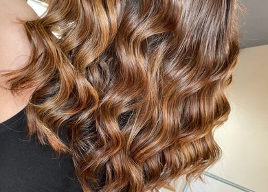 Beautiful wavy brunette hair styled at Aaran Sutton Hair, Aberdeen, Scotland, GB.