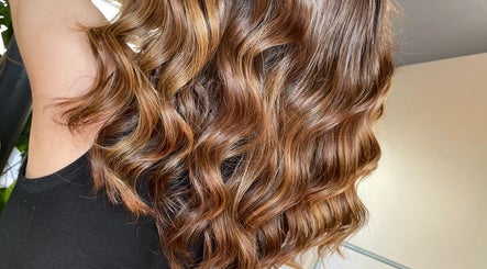 Beautiful wavy brunette hair styled at Aaran Sutton Hair, Aberdeen, Scotland, GB.