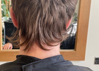 Back view of a stylish mullet haircut at Aaran Sutton Hair, Aberdeen, Scotland, GB.