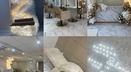 Elegant interior of Aaran Sutton Hair, Aberdeen, Scotland with chic seating and glamorous décor.