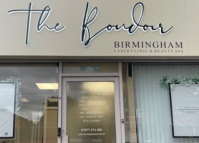 Sharainesbeauty entrance in Birmingham, England, GB with signage and floral decor.