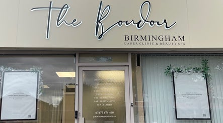 Sharainesbeauty entrance in Birmingham, England, GB with signage and floral decor.