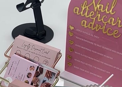 Nail aftercare advice and loyalty card display at Sharainesbeauty in Birmingham, England, GB.