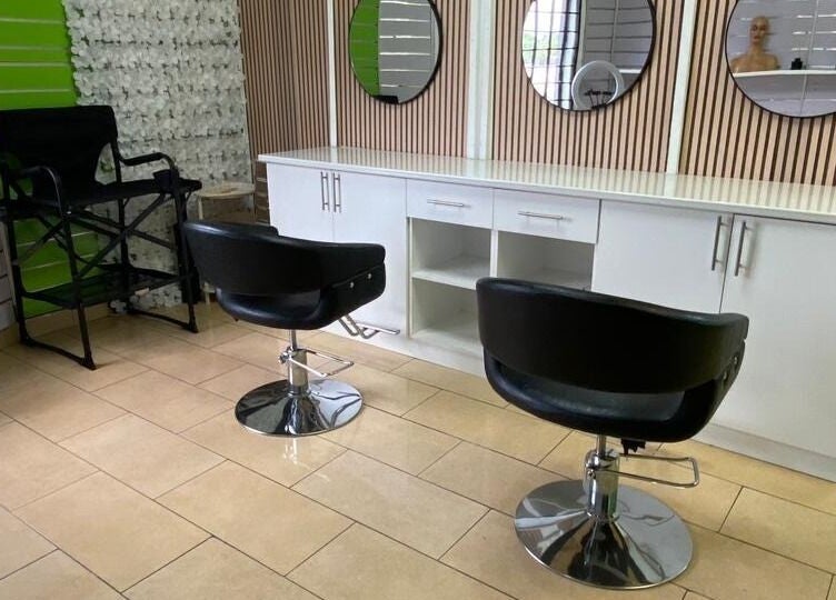 Modern salon setup at BusiNails, Centurion, Gauteng, ZA with stylish chairs and mirrors.
