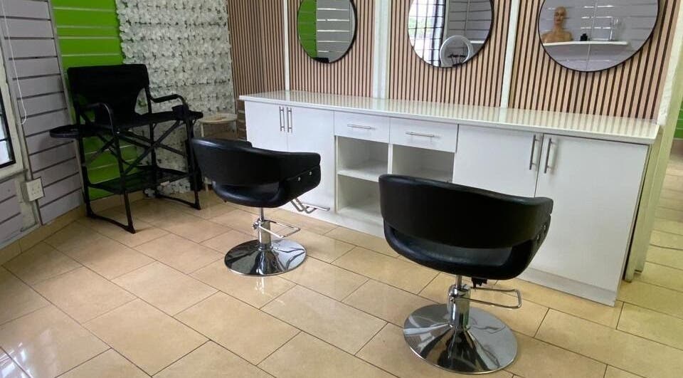 Modern salon setup at BusiNails, Centurion, Gauteng, ZA with stylish chairs and mirrors.