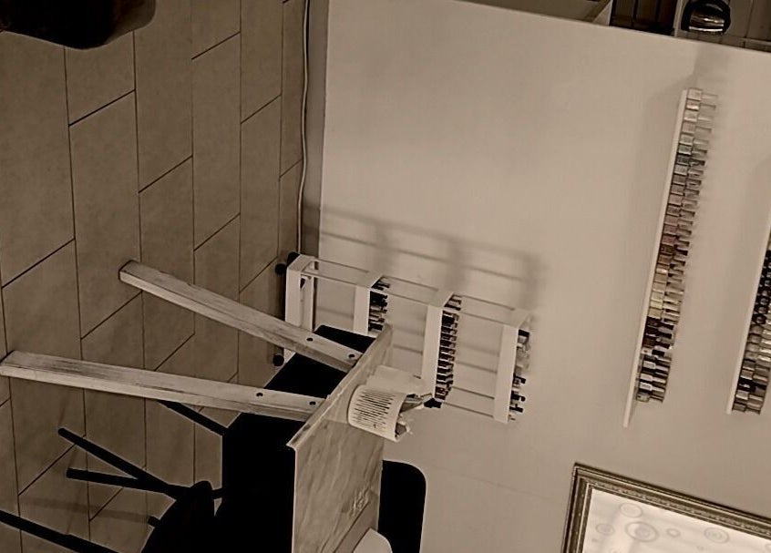 Interior of BusiNails salon in Centurion, Gauteng, ZA showcasing stylish nail polish displays.