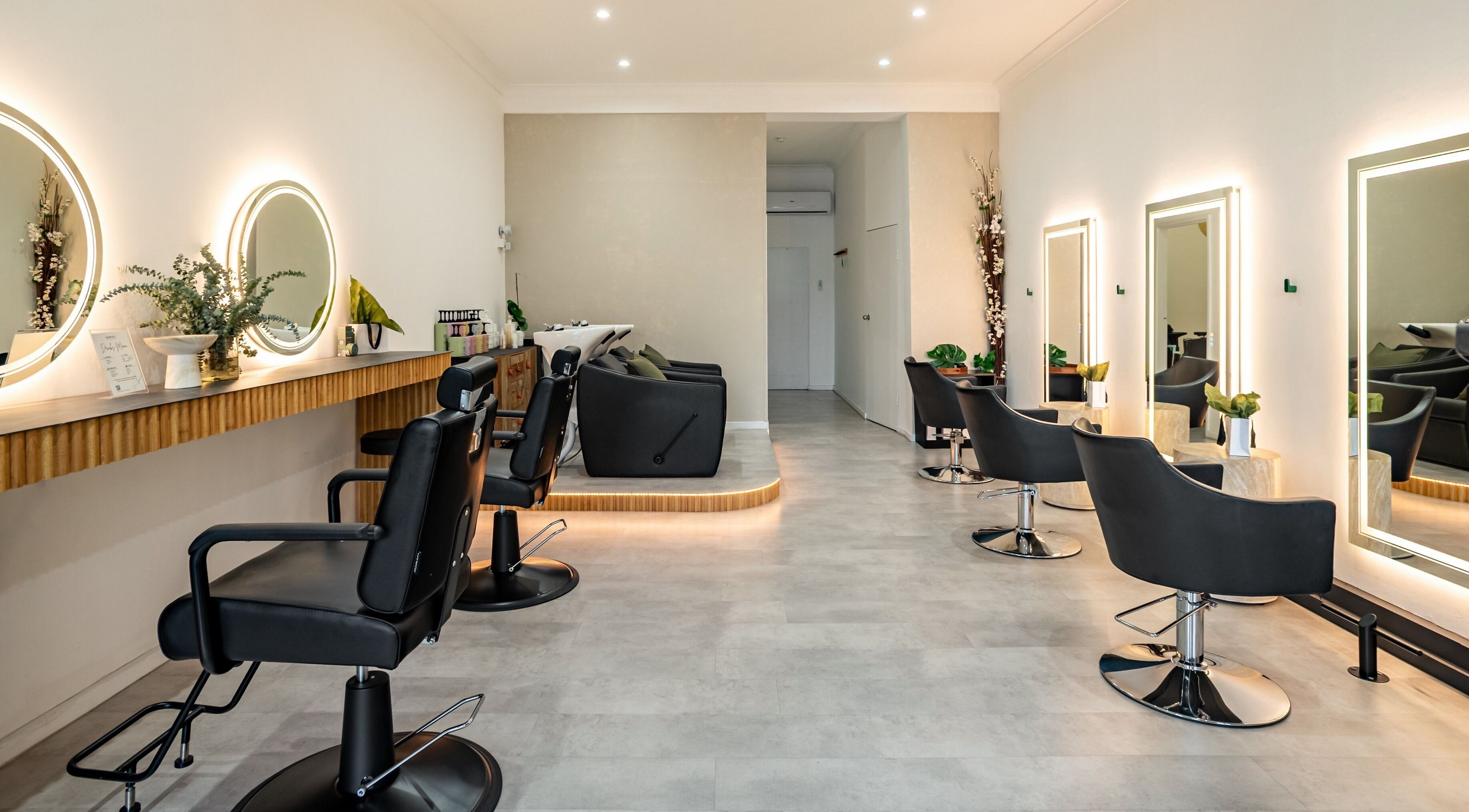 Modern salon chairs and vanity mirrors at Haircult Beauty Lab, Rockdale, New South Wales, AU.
