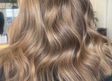 Golden wavy hairstyle at Lauren Willett Bespoke Hair the Loft by Westworks Collective, Bexhill, England, GB.