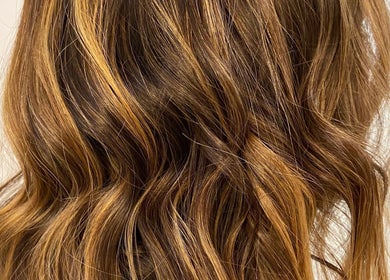 Golden brown hair styled in waves at Lauren Willett Bespoke Hair the Loft. By Westworks Collective, Bexhill, England, GB.