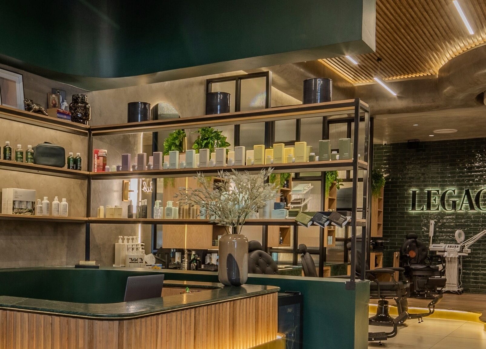 Interior of Legacy Barbers - The Verge, Johannesburg, Gauteng, ZA showcasing modern design with products displayed neatly.