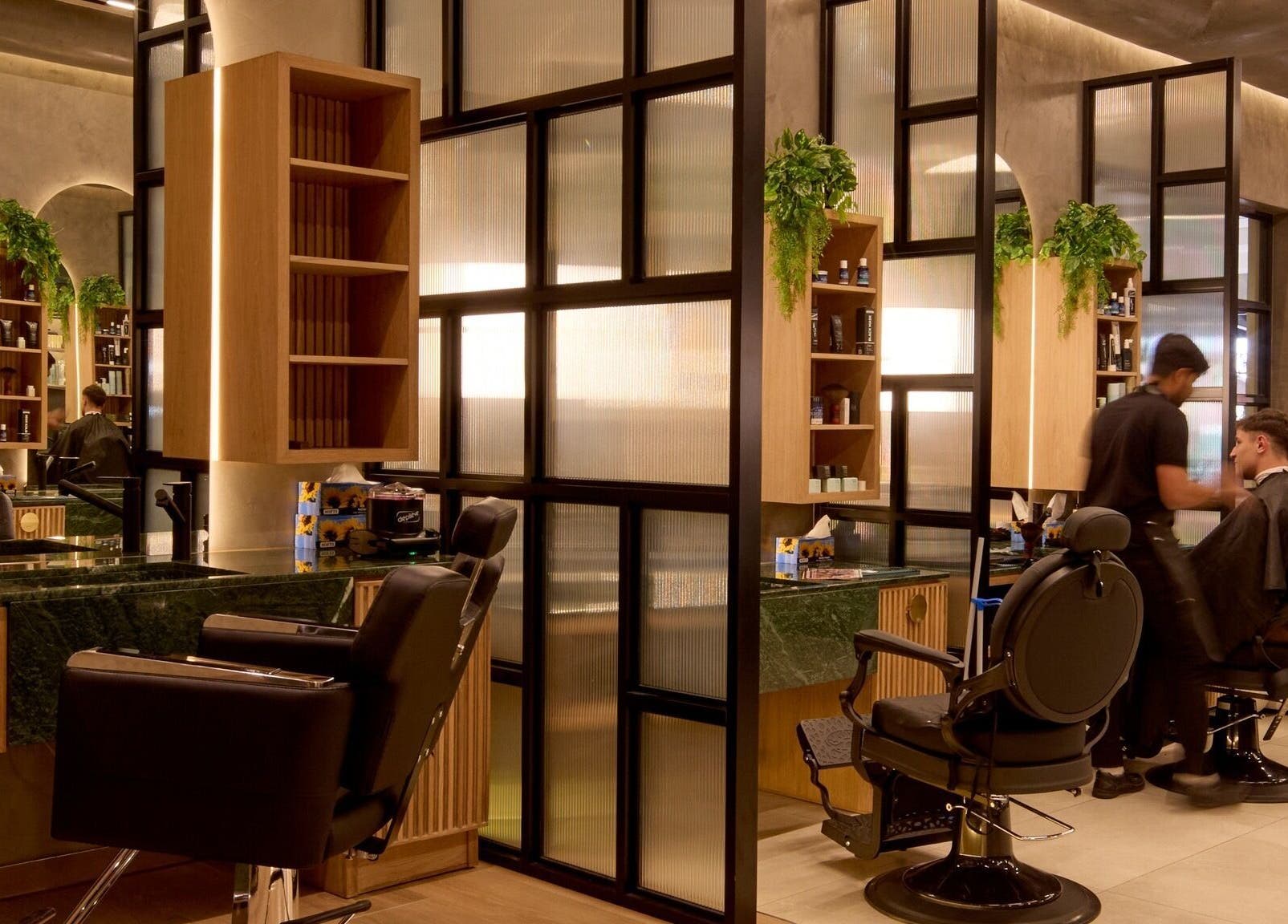 Stylish interior of Legacy Barbers - The Verge, Johannesburg, Gauteng, ZA, showcasing modern barber chairs.