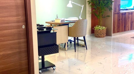Elegant nail workspace at Nail Boutique By Leann, Il-gżira, MT, featuring stylish furniture and greenery.