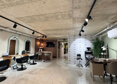 Modern interior of Nail Boutique By Leann in Il-gżira, MT, featuring sleek chairs and elegant lighting.