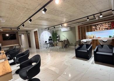 Interior view of Nail Boutique By Leann in Il-gżira, MT with modern styling stations and cozy seating.