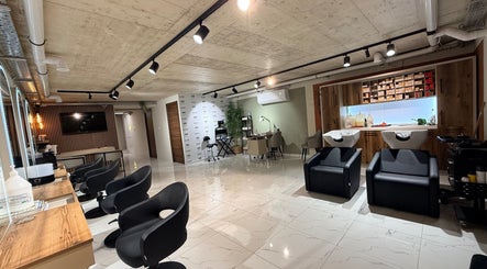 Interior view of Nail Boutique By Leann in Il-gżira, MT with modern styling stations and cozy seating.