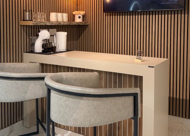 Modern coffee nook at Nail Boutique By Leann in Il-gżira, MT with elegant seating and decor.