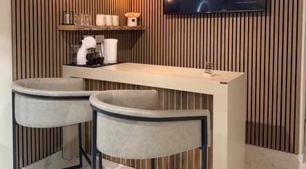 Modern coffee nook at Nail Boutique By Leann in Il-gżira, MT with elegant seating and decor.