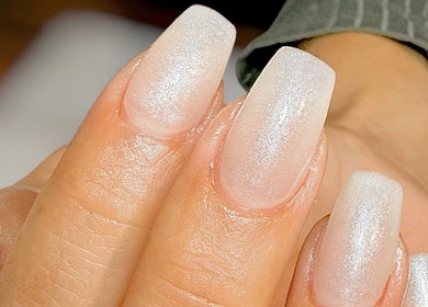 Glittering white nails at Nail Boutique By Leann, Il-gżira, MT, showcasing chic elegance and style.