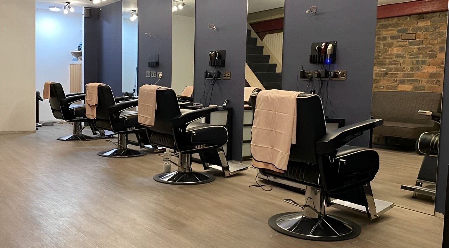 Stylish barber chairs at Scott's Barbers, Clarkston, Scotland, GB. Modern and inviting interior.