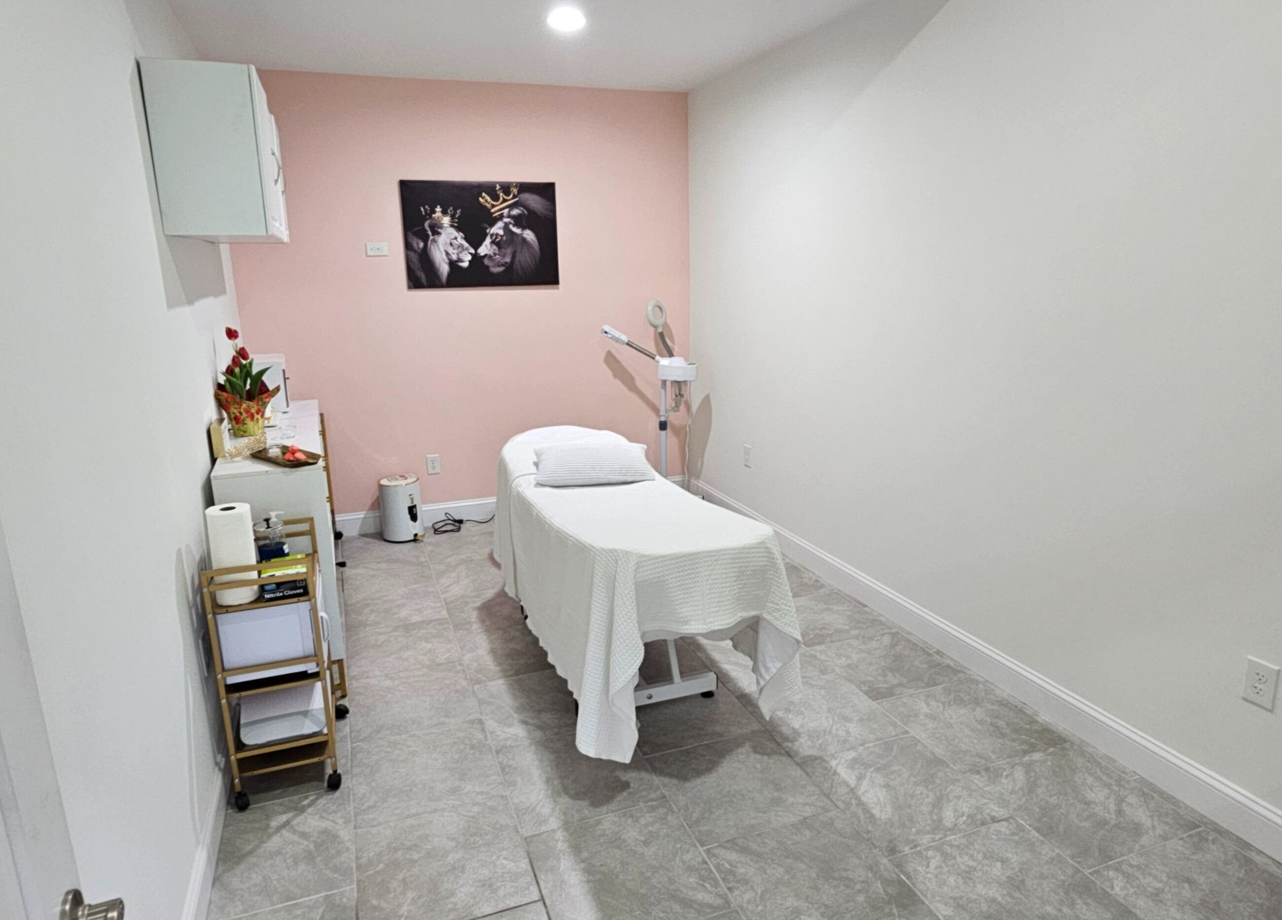 Tranquil treatment room at Majestic Day Spa - Acton, MA, featuring a treatment bed and soft lighting.