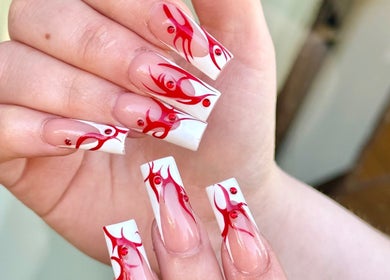 Intricate red flame nail art at Turbo Nails - Burnsville, MN. Stunning design in Burnsville, Minnesota, US.