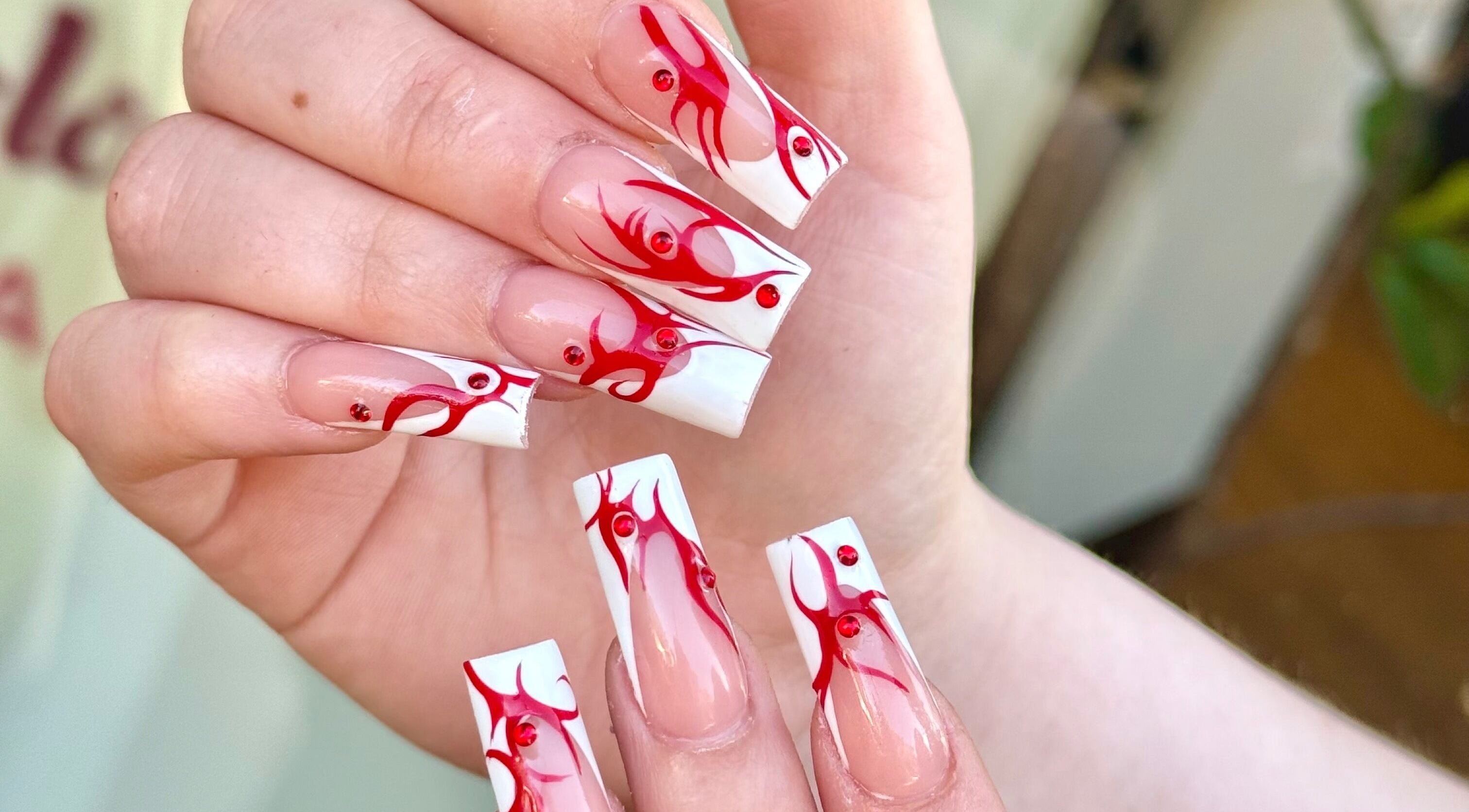 Elegant red flame nail art by Turbo Nails - Burnsville, MN, showcasing creative designs. Located in Burnsville, Minnesota, US.
