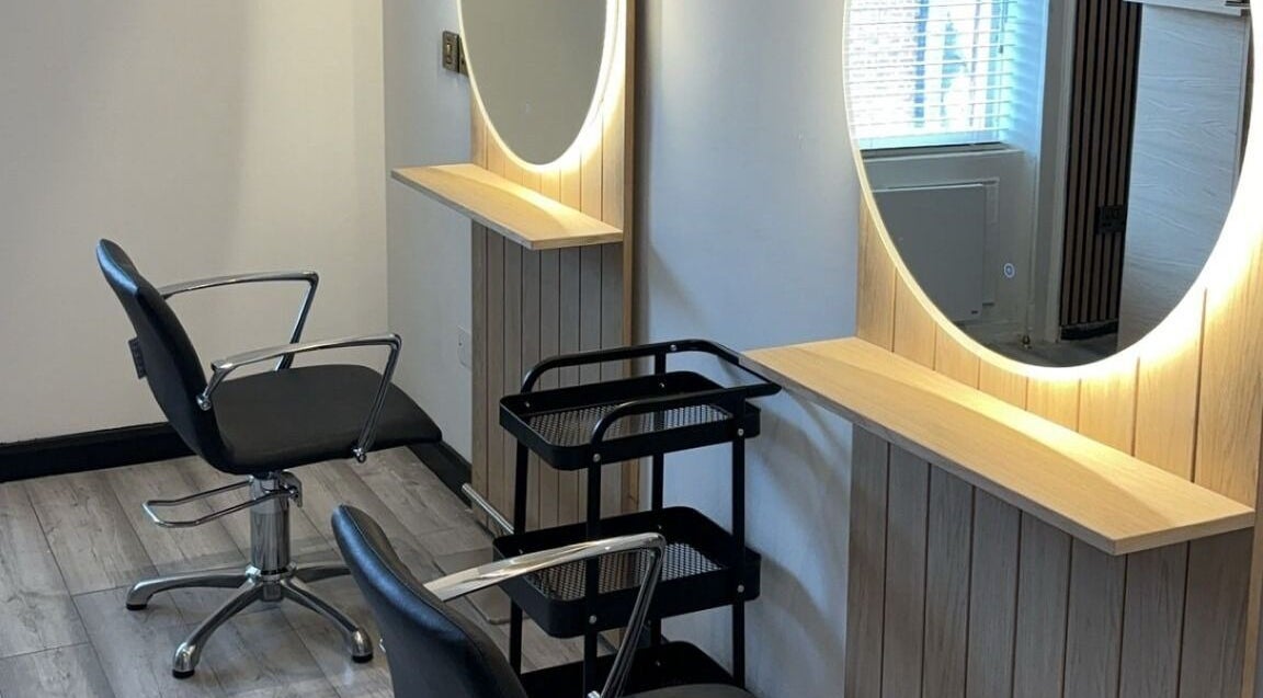 Modern styling chair and lit mirror at The Hair Room, Dublin, County Dublin, IE.
