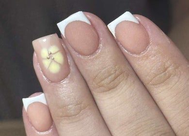 Stylish nail art with floral design at Nails by Aisha, Pudsey, England, GB. Perfect for beauty enhancements.