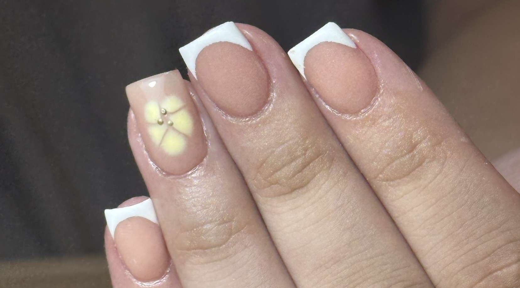 Stylish nail art with floral design at Nails by Aisha, Pudsey, England, GB. Perfect for beauty enhancements.