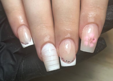 Stylish French manicure with glitter at Nails by Aisha, Pudsey, England, GB.